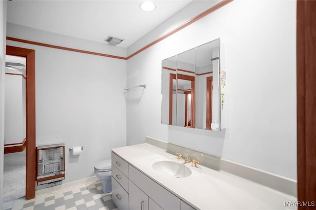 120 Willow Ln, Wetumpka, AL 36092 - bathroom featuring tile patterned floors, heating unit, toilet, vanity, and baseboards