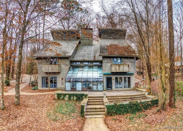 120 Willow Ln, Wetumpka, AL 36092 - view of front facade with french doors, metal roof, and a balcony