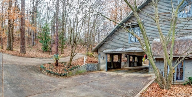 view of property exterior featuring a carport