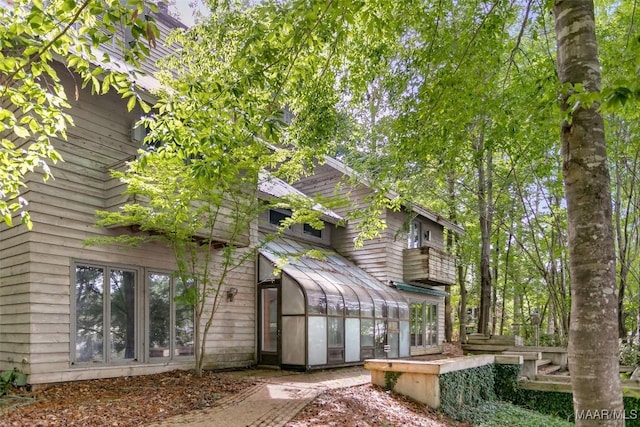 120 Willow Ln, Wetumpka, AL 36092 - rear view of house with a sunroom