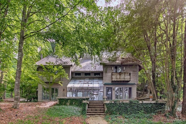120 Willow Ln, Wetumpka, AL 36092 - view of front of house featuring metal roof, french doors, and stairs