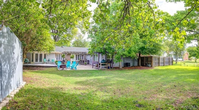 view of yard with a patio, central AC, and a pergola