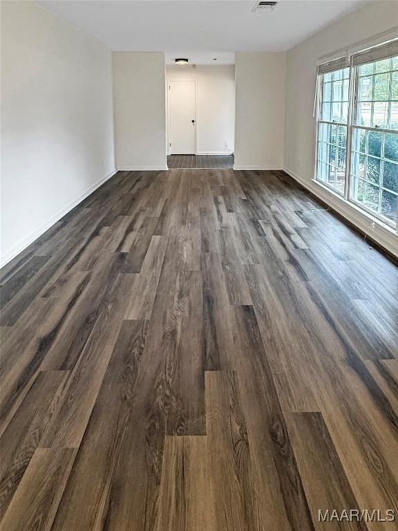 empty room featuring dark hardwood / wood-style floors