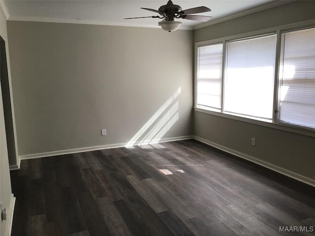 empty room featuring crown molding, dark hardwood / wood-style floors, and ceiling fan