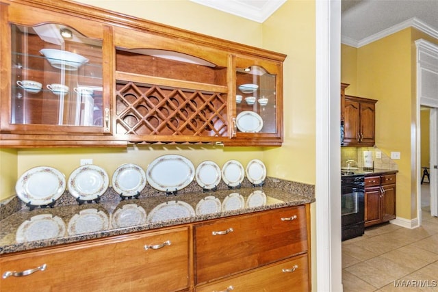 bar with crown molding, black range, and stone counters