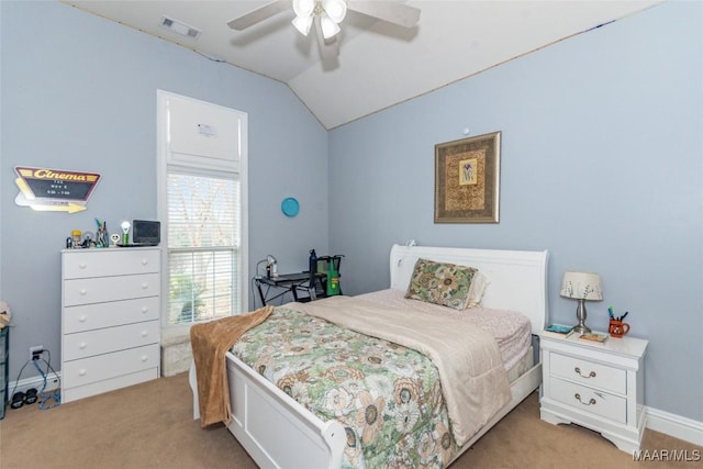 bedroom with ceiling fan, lofted ceiling, and light carpet