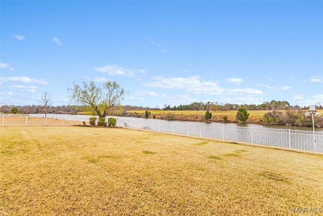 view of yard featuring a rural view and a water view