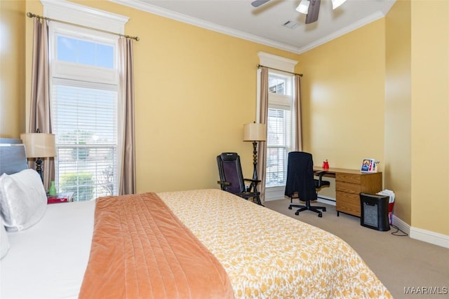 carpeted bedroom featuring crown molding and ceiling fan