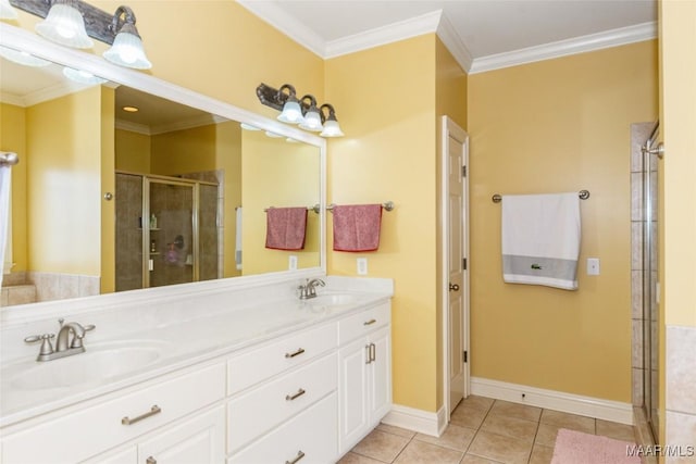 bathroom featuring tile patterned flooring, vanity, crown molding, and a shower with shower door