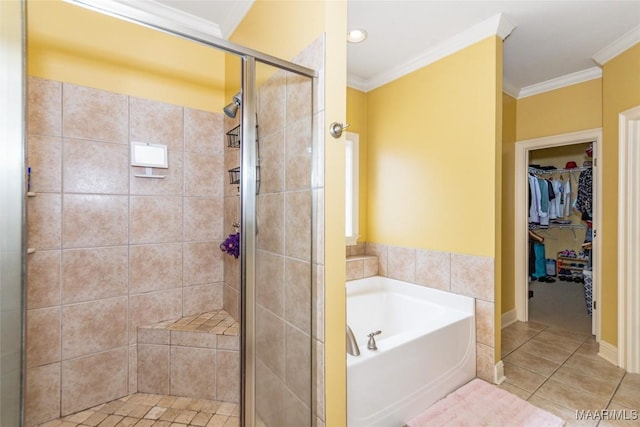 bathroom with tile patterned flooring, ornamental molding, and shower with separate bathtub