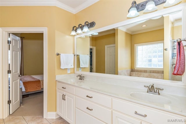 bathroom with tile patterned flooring, ornamental molding, and vanity