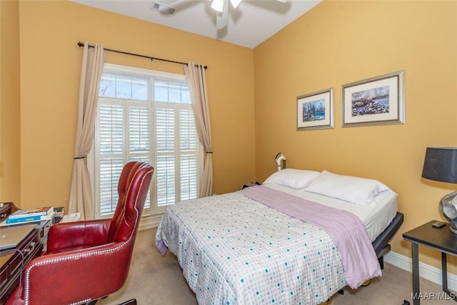 carpeted bedroom with multiple windows and ceiling fan