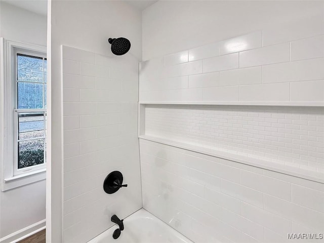 details with tiled shower / bath combo