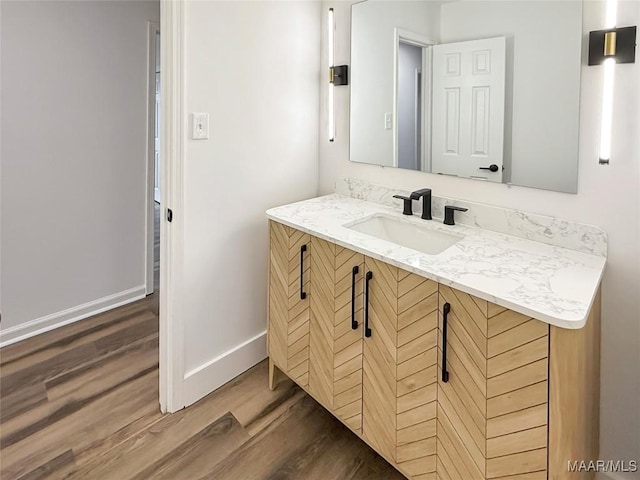 bathroom featuring vanity and hardwood / wood-style floors