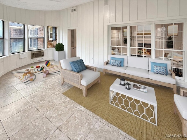 interior space with visible vents, a wall mounted AC, and wooden walls