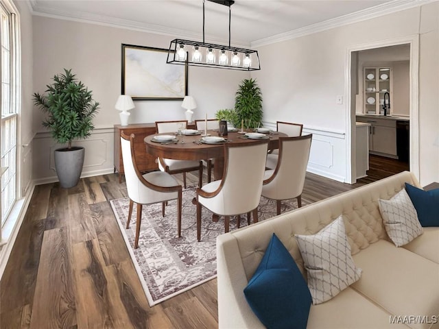 dining area with crown molding, dark wood finished floors, and a decorative wall