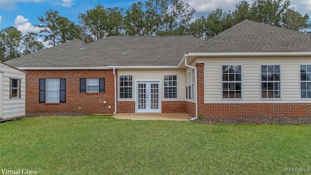 back of property with brick siding, roof with shingles, and french doors
