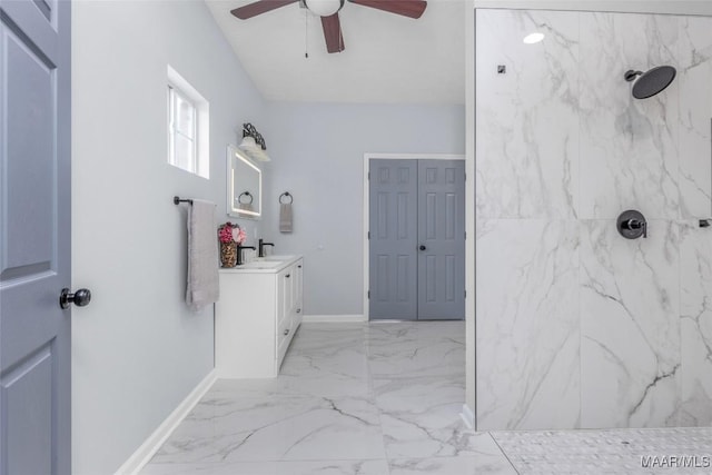 bathroom with vanity, a tile shower, and ceiling fan