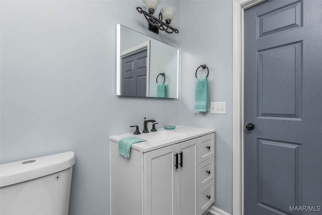 bathroom with toilet and vanity