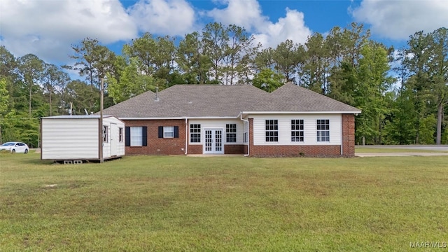 541 Baltzer Rd, Wetumpka, AL 36092 - back of property featuring french doors, a yard, brick siding, and a shingled roof