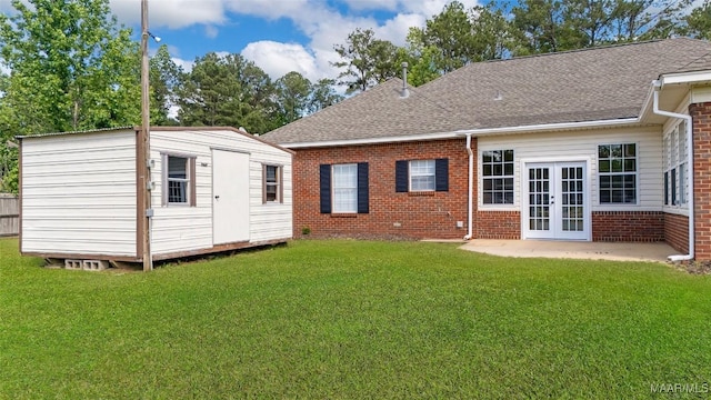 541 Baltzer Rd, Wetumpka, AL 36092 - back of property with brick siding, french doors, a shingled roof, and a lawn