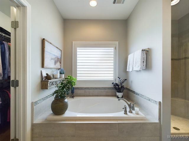 bathroom with independent shower and bath