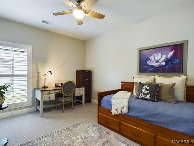 bedroom featuring ceiling fan and light colored carpet