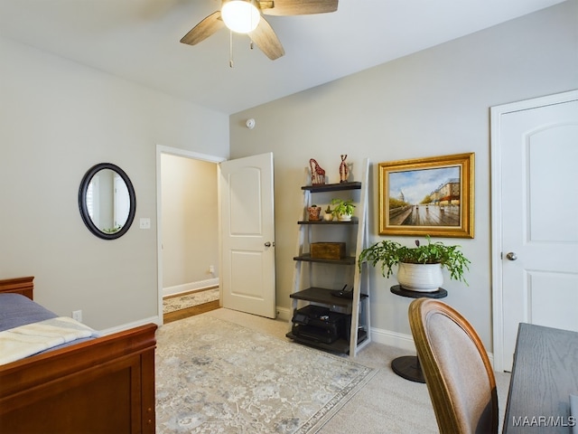 bedroom with ceiling fan and light carpet