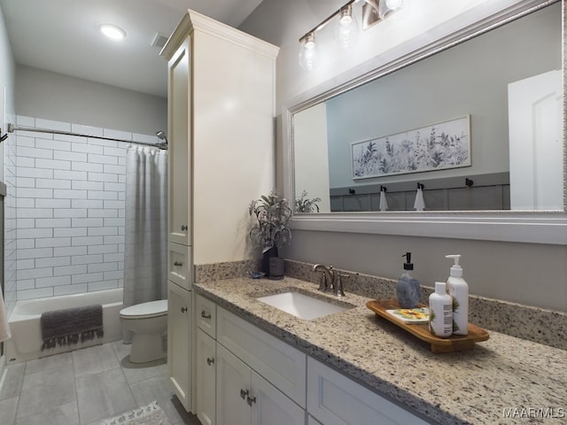 full bathroom featuring shower / bath combination with curtain, tile patterned floors, vanity, and toilet