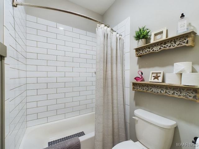 bathroom featuring toilet and shower / tub combo