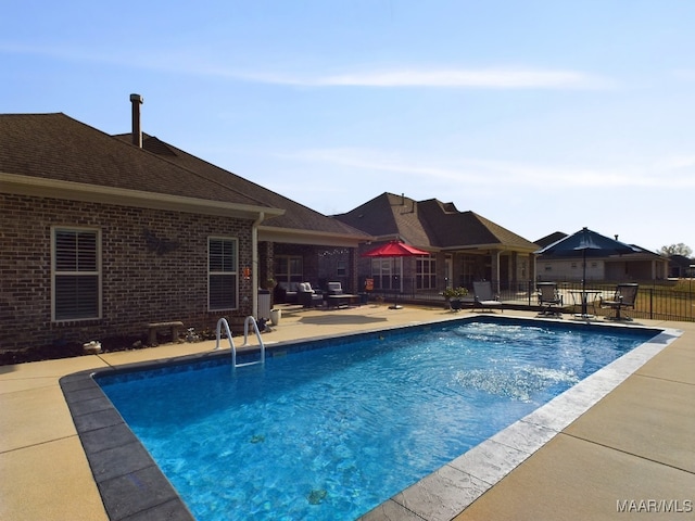 view of swimming pool featuring a patio area