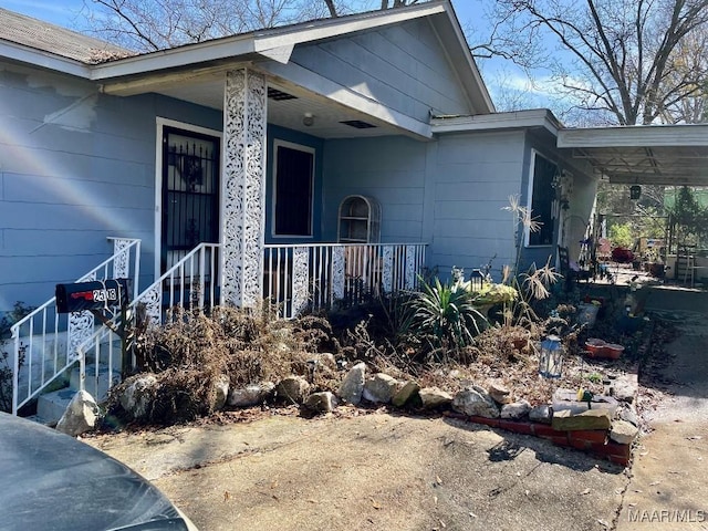 entrance to property with covered porch