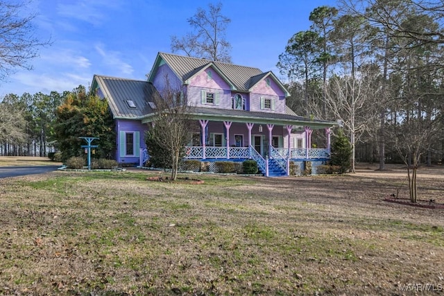 view of front of home with a porch and a front lawn