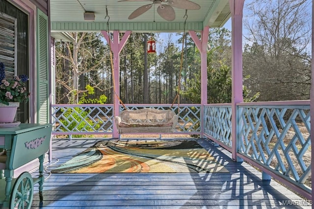 wooden deck with ceiling fan