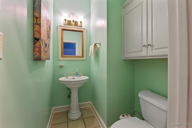 bathroom featuring tile patterned floors and toilet