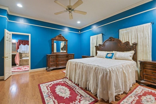 bedroom with hardwood / wood-style flooring, ceiling fan, connected bathroom, and crown molding