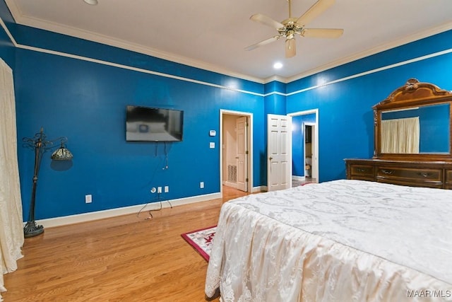 bedroom with ceiling fan, ornamental molding, and hardwood / wood-style floors