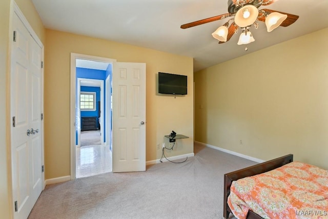 bedroom with ceiling fan and carpet floors