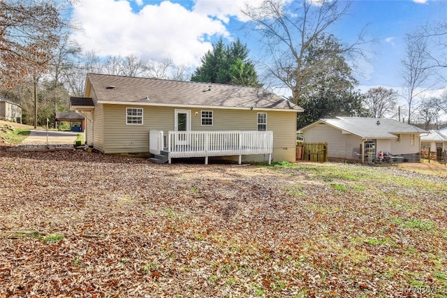 rear view of property with a deck