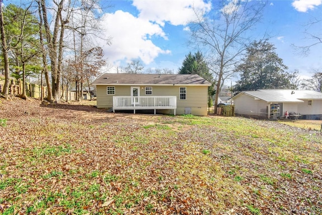 back of property featuring a deck