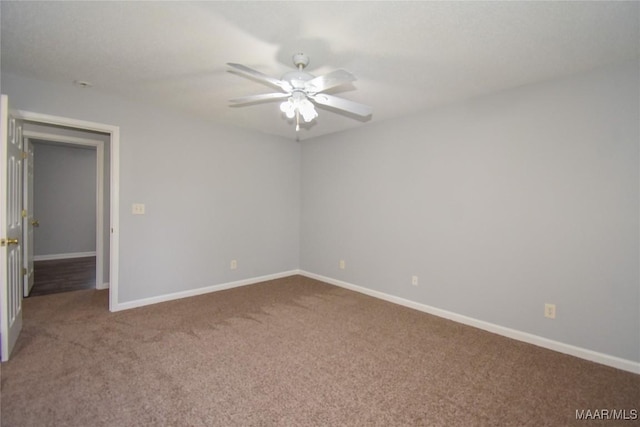 empty room featuring carpet and ceiling fan