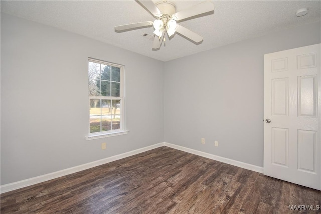 unfurnished room with ceiling fan, dark hardwood / wood-style floors, and a textured ceiling