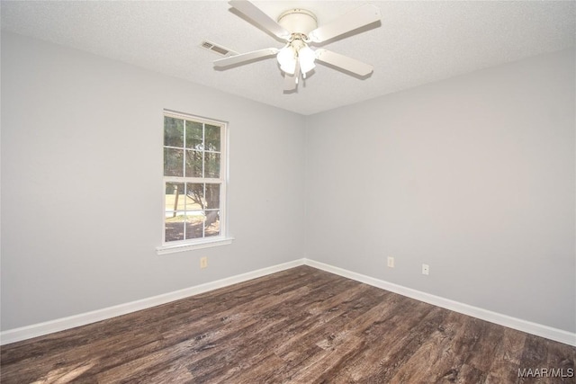 spare room featuring hardwood / wood-style flooring, ceiling fan, and a textured ceiling