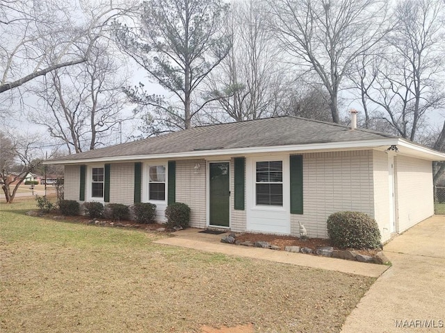 ranch-style home featuring a front yard