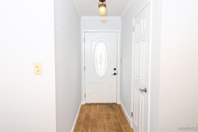 doorway with wood-type flooring and crown molding