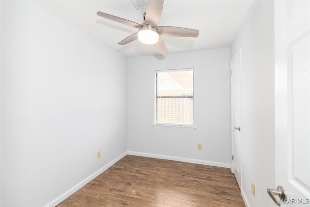 empty room with ceiling fan and wood-type flooring