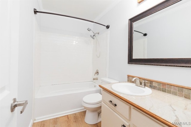 full bathroom with vanity, hardwood / wood-style floors, toilet, and washtub / shower combination