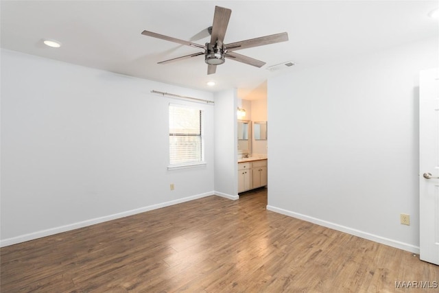 interior space with hardwood / wood-style floors and ceiling fan