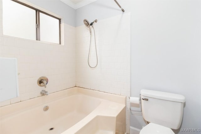 bathroom with toilet and tiled shower / bath combo