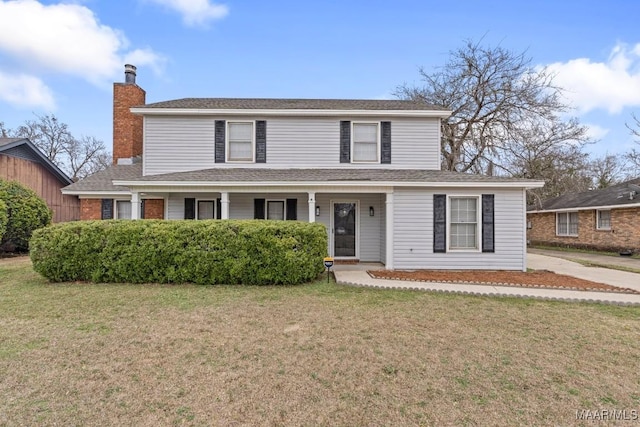 view of front of property featuring a front lawn